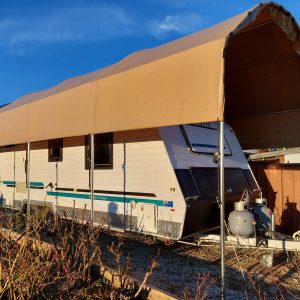Large caravan shelter with a caravan underneath