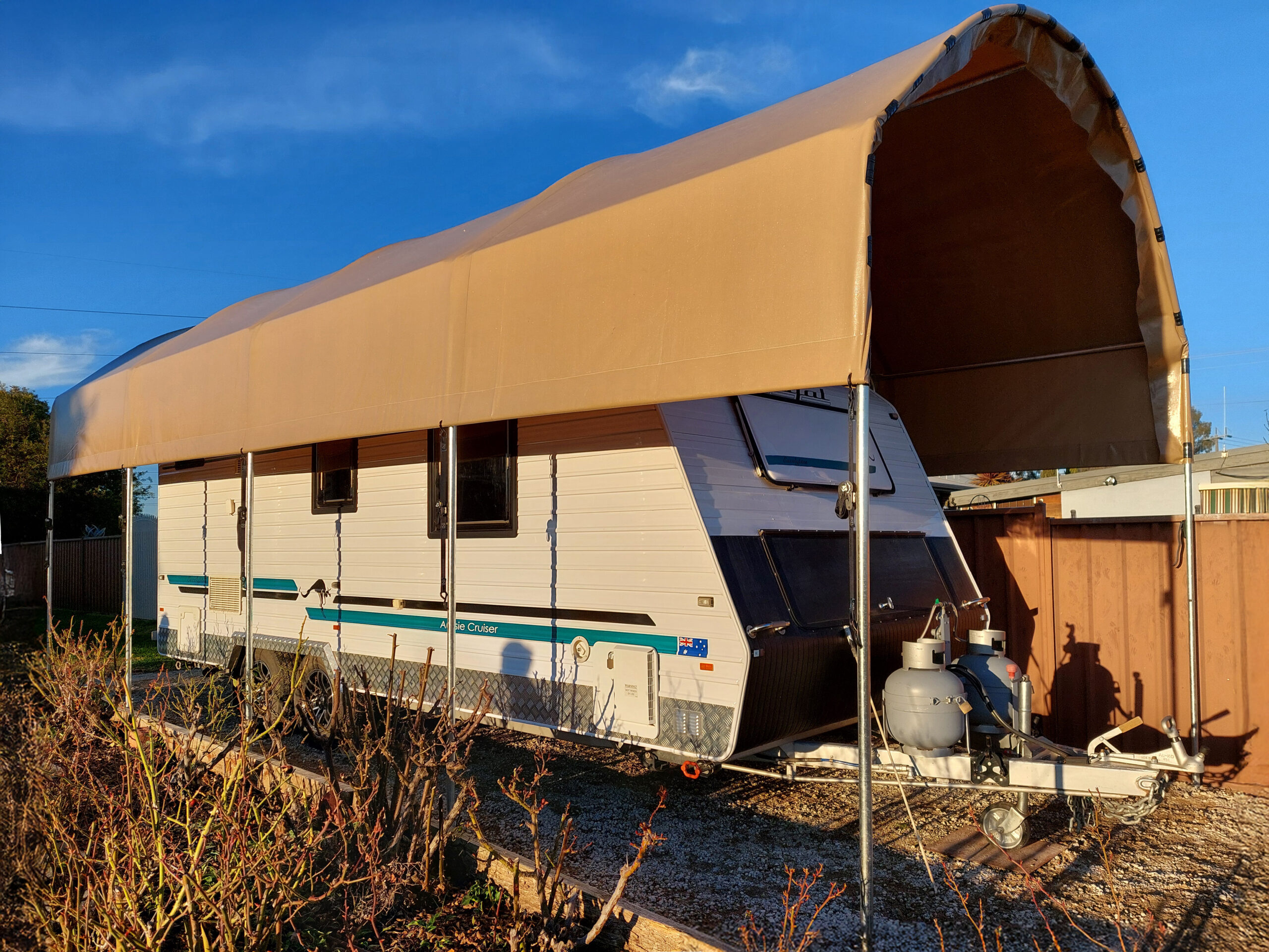 Large caravan shelter with a caravan underneath