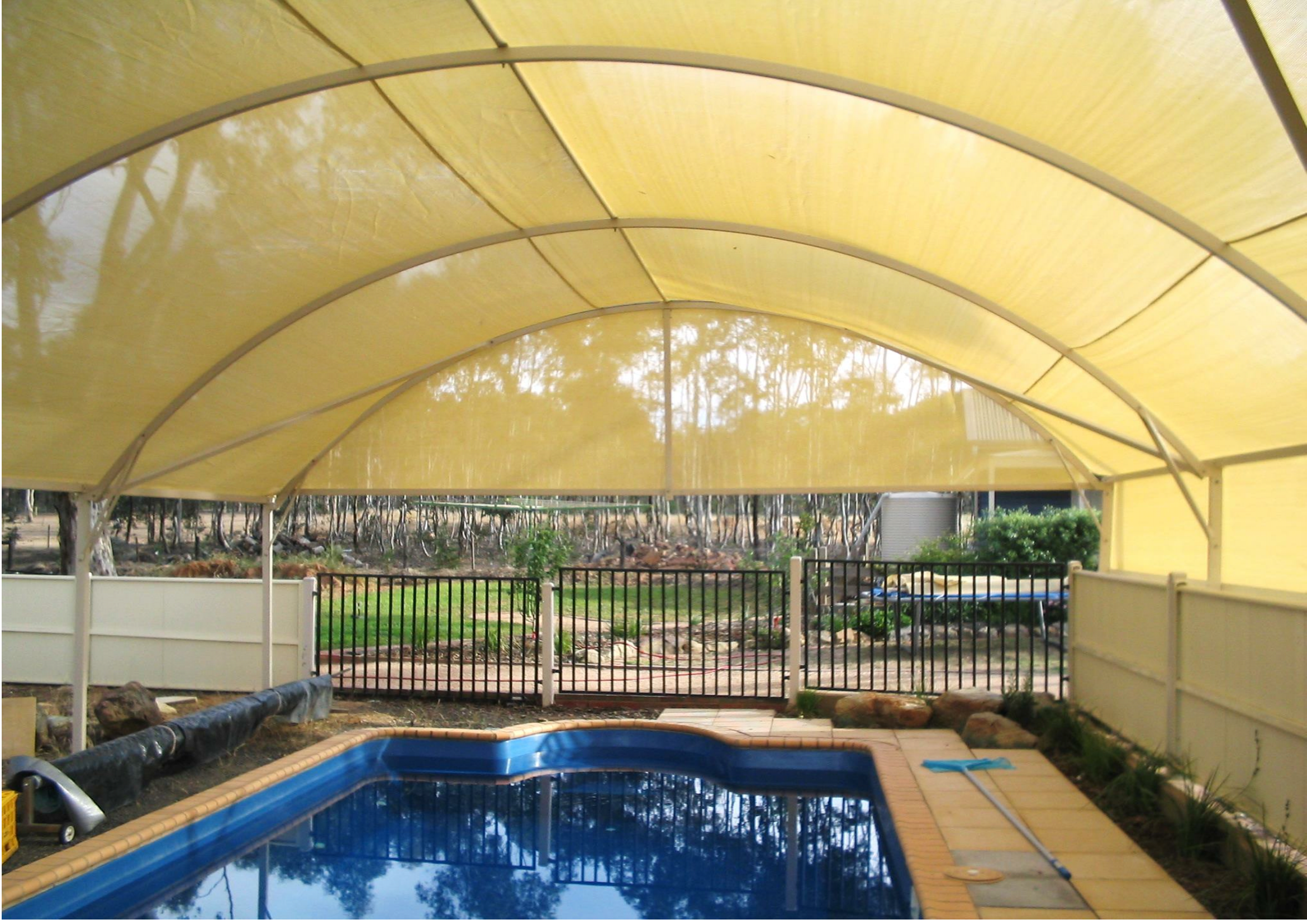 Undercover pool with a barrier